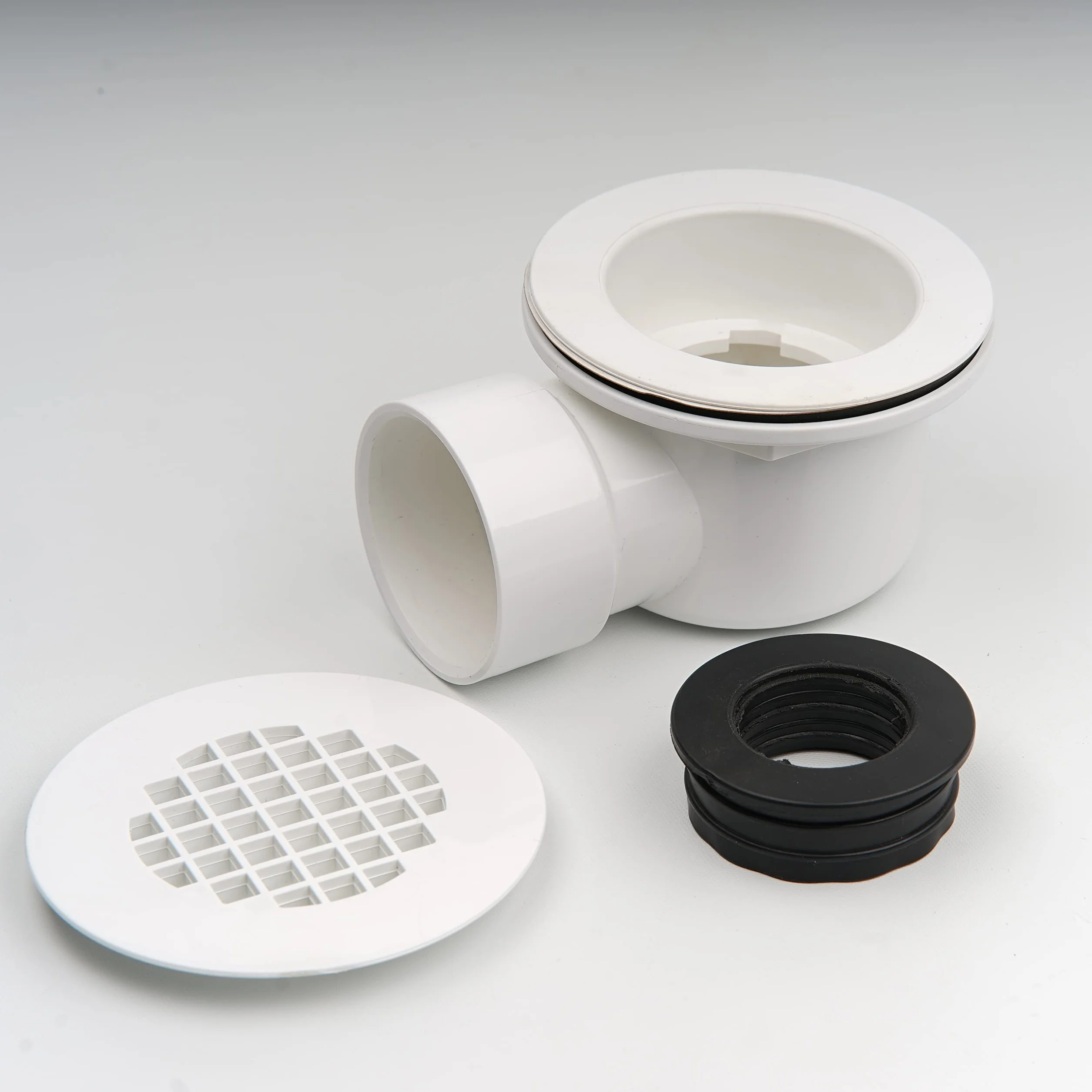 Niskoprofilowy odpływ prysznicowy 5 cm z reduktorem 5 cm x 1-1/5.1 cm i perforowanym sitkiem - zespół odpływu bocznego z PCW do wymiany podstawy prysznicowej i odpływu