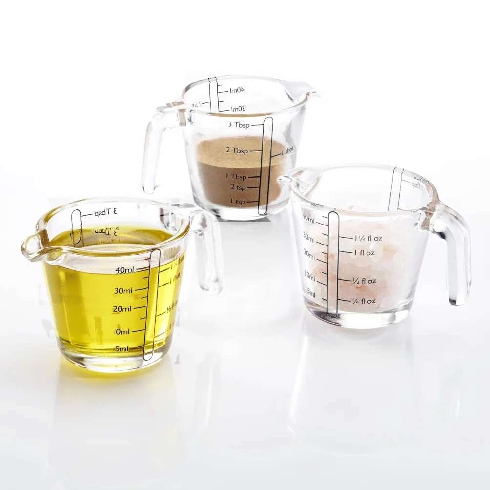 Westmark 305522E3 2 mini szklanki z miarką, 40 ml, 4 różne skale, nadają się do piekarnika, kuchenki mikrofalowej i zamrażarki, kolor przezroczysty/czarny