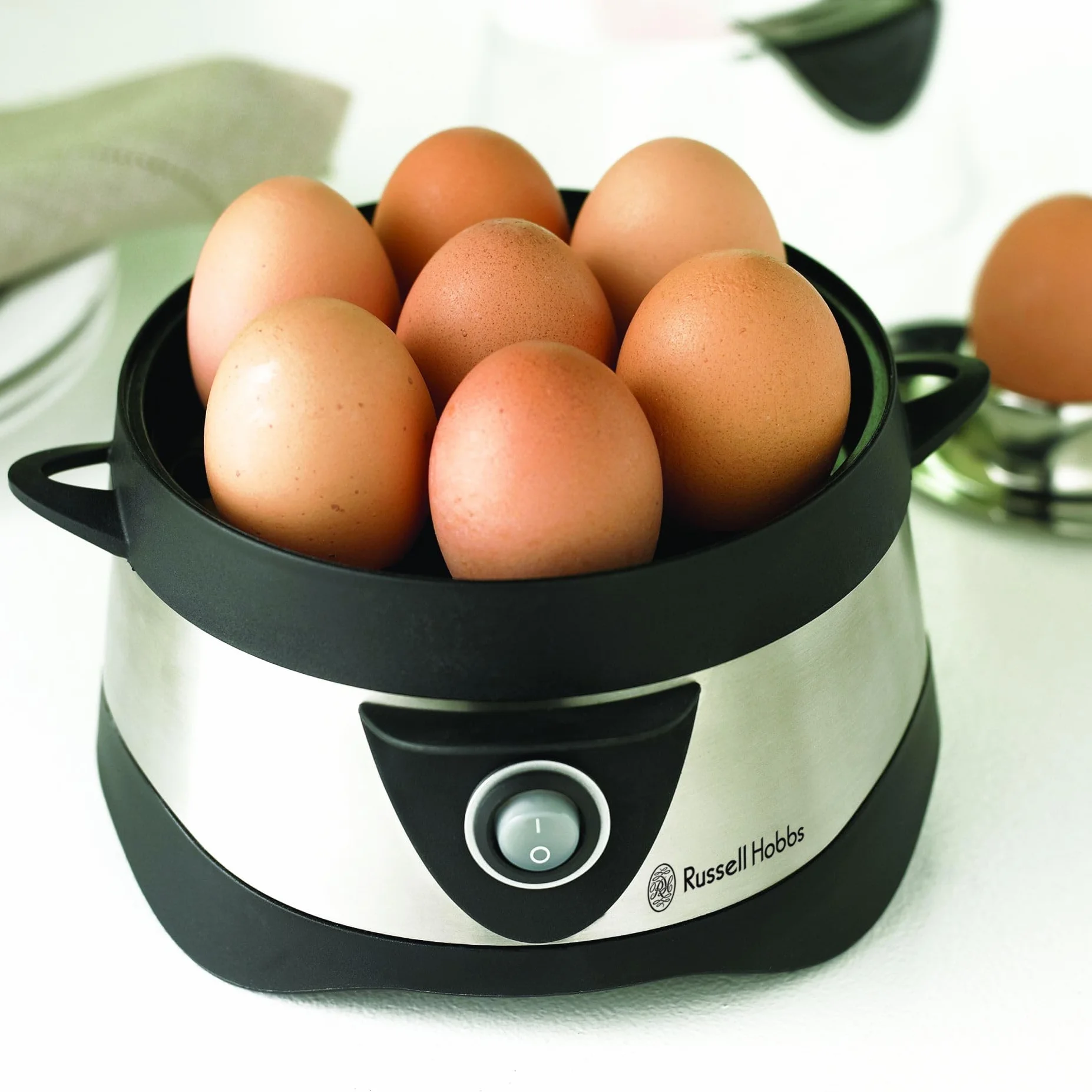 Russell Hobbs jajowar, regulacja twardości jaj, wutomatyczne wyłączenie, wyjmowane elementy, do 7 jaj gotowanych, do 3 jaj sadzonych, stal nierdzewna, plastikowa pokrywka, moc 365W, jajowar 14048-56